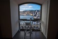 View of Old port area, `Porto Antico`, touristic place in Genoa, Italy, through a window of a bar. Royalty Free Stock Photo