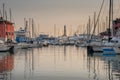 View of the old port of Genoa at sunset with Lanterna lighthouse, Italy. Royalty Free Stock Photo