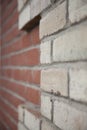 Old red and white brick wall with rich colorful grainy texture and details Royalty Free Stock Photo