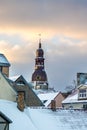 View on Old Riga roofs and Saint Peters Church tower on sunset. Royalty Free Stock Photo