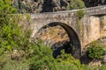 View of old roman bridge over Paiva river, in stone, with vegetation around Royalty Free Stock Photo