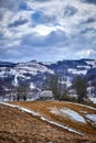 View of the old ruined house building on the hills in winter, Dumesti, Romania,  vertical Royalty Free Stock Photo