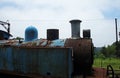 VIEW OF OLD RUSTED BLUE PAINTED STEAM LOCOMOTIVE Royalty Free Stock Photo