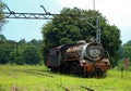 VIEW OF AN OLD RUSTED STEAM LOCOMOTIVE AT AN ABANDONED STATION Royalty Free Stock Photo