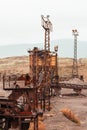 Old and rusty abandoned mine equipment in the middle of a desert. Royalty Free Stock Photo