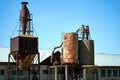 View of old rusty barrel constructions under the blue sky