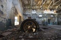 Old rusty engine in an abandoned industrial building
