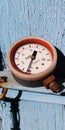 Old soviet pressure gauge in a carbolite case on a wooden background