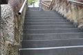 View of an old stairway with metal railings and brick walls in a park Royalty Free Stock Photo