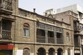 A view of old stone building with windows and balcony at Guruvar Peth, Pune Royalty Free Stock Photo