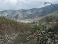 View from old stone paved road at village El Palmar with green hills and valley with terraced fields at Park rural de Royalty Free Stock Photo