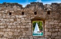 View through old stone window atsailing boat Royalty Free Stock Photo