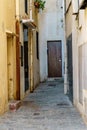 View of old street in Dalt la Vila, building with colored facade, historic center of Badalona, province of Barcelona, Spain Royalty Free Stock Photo