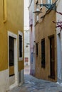 View of old street in Dalt la Vila, building with colored facade, historic center of Badalona, province of Barcelona, Spain Royalty Free Stock Photo