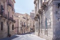 View of old street, facades of ancient buildings in Ortygia Ortigia Island, Syracuse, Sicily, Italy, traditional architecture Royalty Free Stock Photo