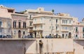 View of old street, facades of ancient buildings in seafront of Ortygia Ortigia Island, Syracuse, Sicily, Italy