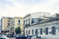 View of old street, facades of ancient buildings in seafront of Ortygia Ortigia Island, Syracuse, Sicily, Italy