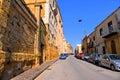 25.08.2018. View of old street with traffic, old buildings and facade of Cathedral in the historical city of Agrigento in Sicily,