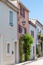 View on old streets, fort walls and houses in ancient french town Aigues-Mortes, touristic destination with square fortress, Gard Royalty Free Stock Photo