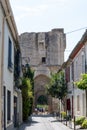 View on old streets, fort walls and houses in ancient french town Aigues-Mortes, touristic destination with square fortress, Gard Royalty Free Stock Photo