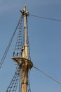 View of an old tall ship mast with rigging and shrouds against a deep blue sky Royalty Free Stock Photo