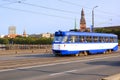 View of old town bell tower of Riga Cathedral and old tram on the Stone bridge, Riga, Latvia