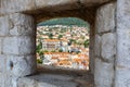 View of the old town of Dubrovnik through an opening in the wall of the fortress in Croatia