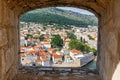 View of the old town of Dubrovnik through an opening in the wall of the fortress in Croatia