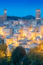 View of old town in the evening night with old tradition buildings and illumination. Sorano, Tuscany, Italy Royalty Free Stock Photo