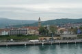 View on the old town Koper in Slovenia situated in Adriatic Sea from container terminal over the basin in port.
