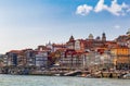 View of Old town skyline from across the Douro River. Front view of the Ribeira historical district. Colorful Houses. Porto.
