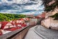 View of old town street and buildings, Strahov Monastery in the background at sunset, Prague, Czech Republic Royalty Free Stock Photo