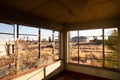 View of the old train station through the broken windows of the abandoned railway town called Putsonderwater, ghost town in South