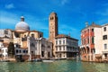 Old buildings, church and belfry on Grand Canal in Venice, Italy