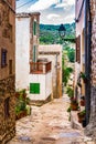 Narrow street in rustic old mediterranean village Royalty Free Stock Photo
