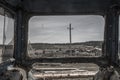 View of the old village from the window of an abandoned tractor. Royalty Free Stock Photo