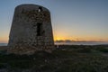 View of old windmill ruins on the coast of Murcia at sunset