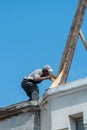 View of the old wooden conical roof. Repair of the roof of the spire of the ancient cathedral. Replacement of tiles in a beautiful Royalty Free Stock Photo