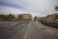 View on one of central streets in Uppsala, Sweden, Europe. Small bridge over river , yellow buildings, red castle far away. Royalty Free Stock Photo