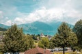 View from one of the railway stations of the Swiss railway. Far away mountains in clouds and haze. Panoramic view of