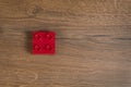 View on one square red toy brick