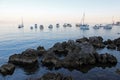 View from Opatija`s seaside promenade, little harbor, beach and anchorage for vessels, Adriatic coast, Kvarner bay, city details,