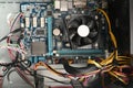 View into an open computer, desktop pc tower with motherboard, cooler and cables Royalty Free Stock Photo