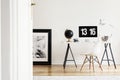 View through an open door to a bright home office interior for an artist with computer on a white desk and hardwood floor. Real ph Royalty Free Stock Photo