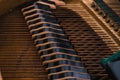 View through the open piano cover of strings, mallets and dampers Royalty Free Stock Photo