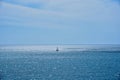 View of the open sea and sailing boat in the distance Royalty Free Stock Photo