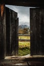 View from the open wooden antique door on the foggy mountains, fog and autumn trees 1 Royalty Free Stock Photo