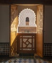 View from open wooden window to main courtyard in madrasa Ben Youssef Madrasa in Marrakesh, Morocco