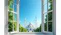 View from opened window frames bright white mosque complex, minarets piercing clear blue sky. Rich green trees flank paved Royalty Free Stock Photo