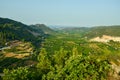 View of orange plantations on the Mediterranean coast of Spain between the mountains. On the horizon the Mediterranean Sea Royalty Free Stock Photo